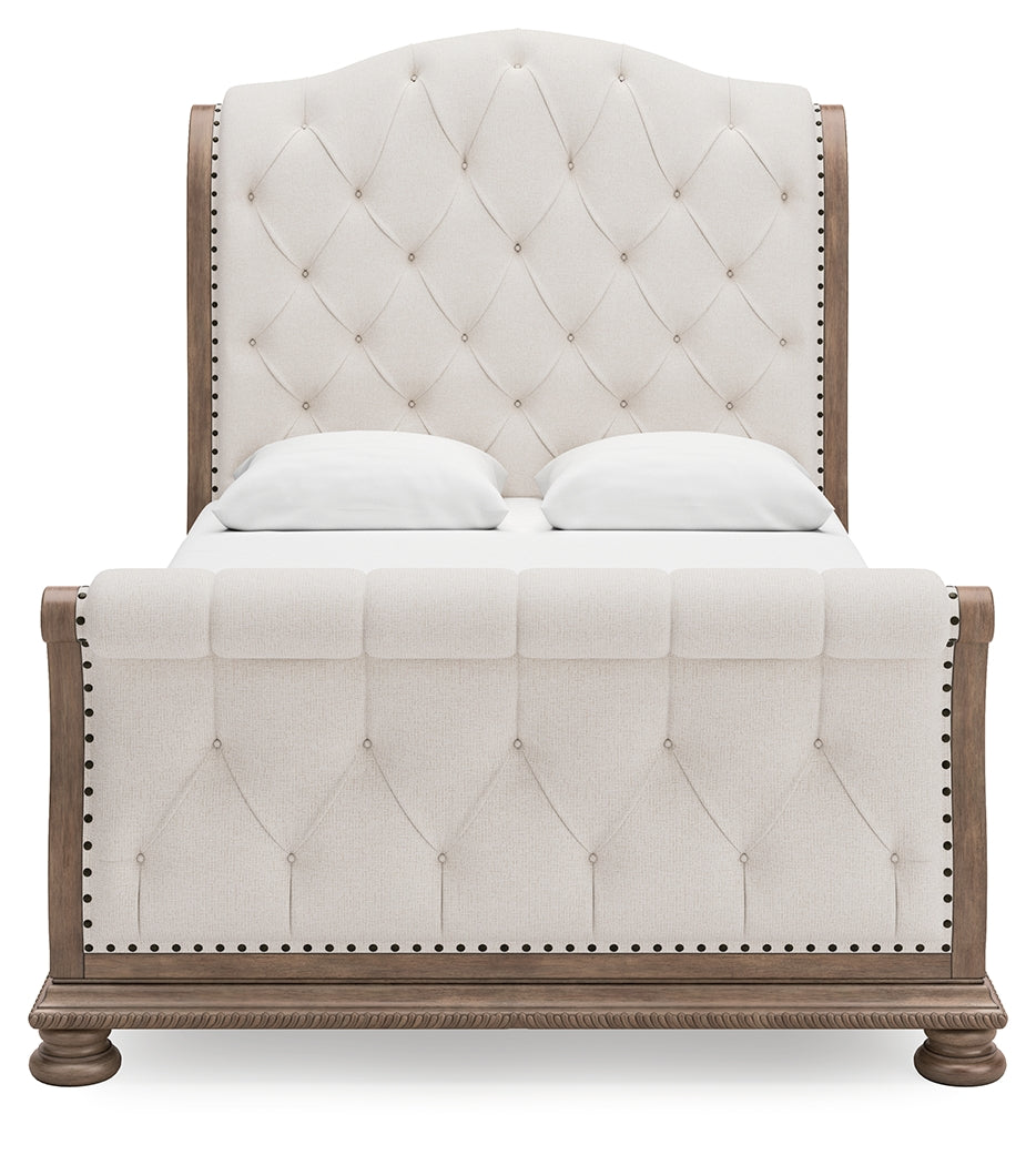 Ardenfield Queen Upholstered Sleigh Bed with Mirrored Dresser in Light Brown from Ashley - Luna Furniture