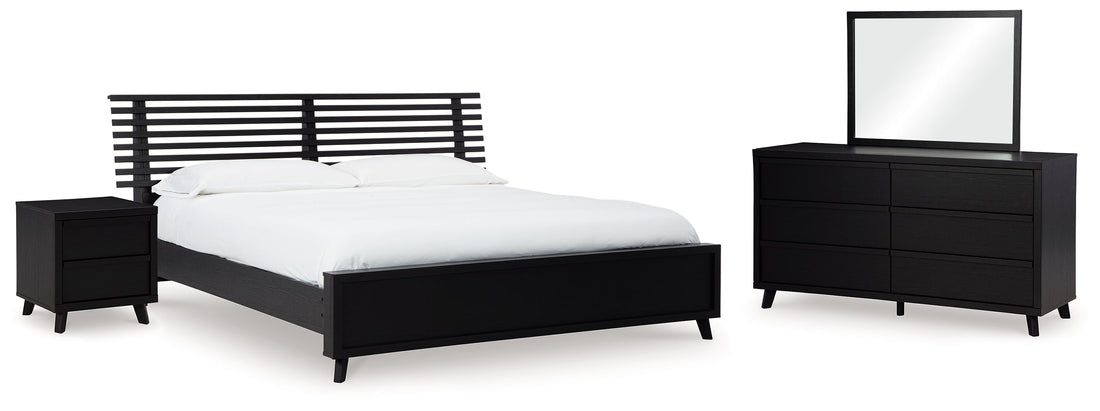Danziar Queen Panel Bed with Mirrored Dresser and Nightstand in Black - PKG015898