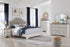 Brollyn Chipped White Upholstered Panel Bedroom Set - SET | B773-54 | B773-57 | B773-92 | B773-46 - Bien Home Furniture & Electronics