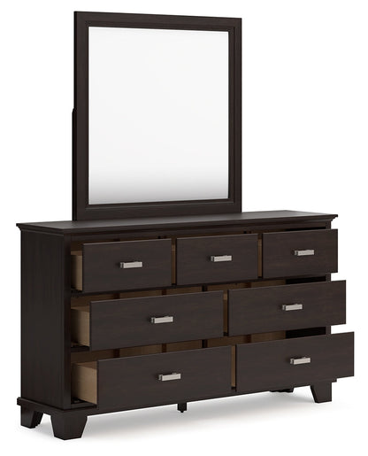 Covetown King Panel Bed with Mirrored Dresser and Chest in Dark Brown from Ashley - Luna Furniture