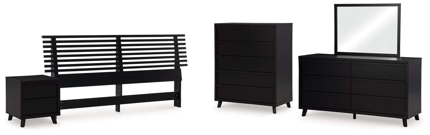 Danziar King Panel Headboard with Mirrored Dresser, Chest and Nightstand in Black - PKG016014