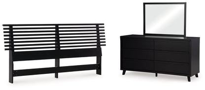 Danziar King Panel Headboard with Mirrored Dresser in Black - PKG016009