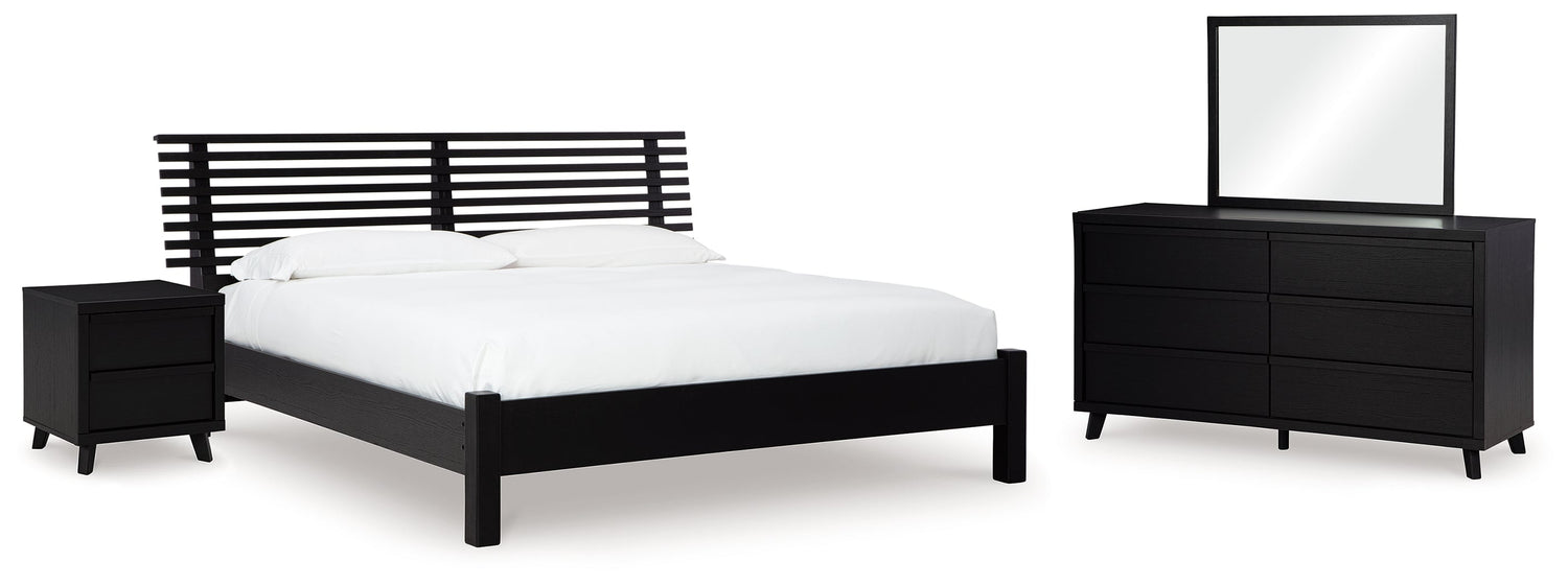 Danziar Queen Panel Bed with Mirrored Dresser and Nightstand in Black - PKG015880