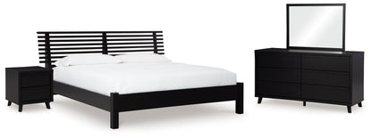 Danziar Queen Panel Bed with Mirrored Dresser and Nightstand in Black - PKG015880