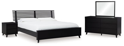 Danziar Queen Panel Bed with Mirrored Dresser and Nightstand in Black - PKG015898