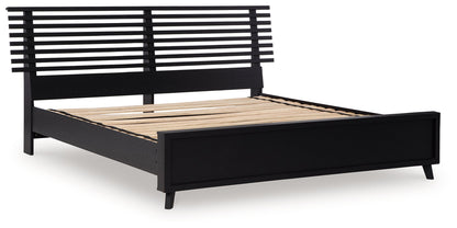 Danziar Queen Panel Bed with Mirrored Dresser and Nightstand in Black - PKG015898