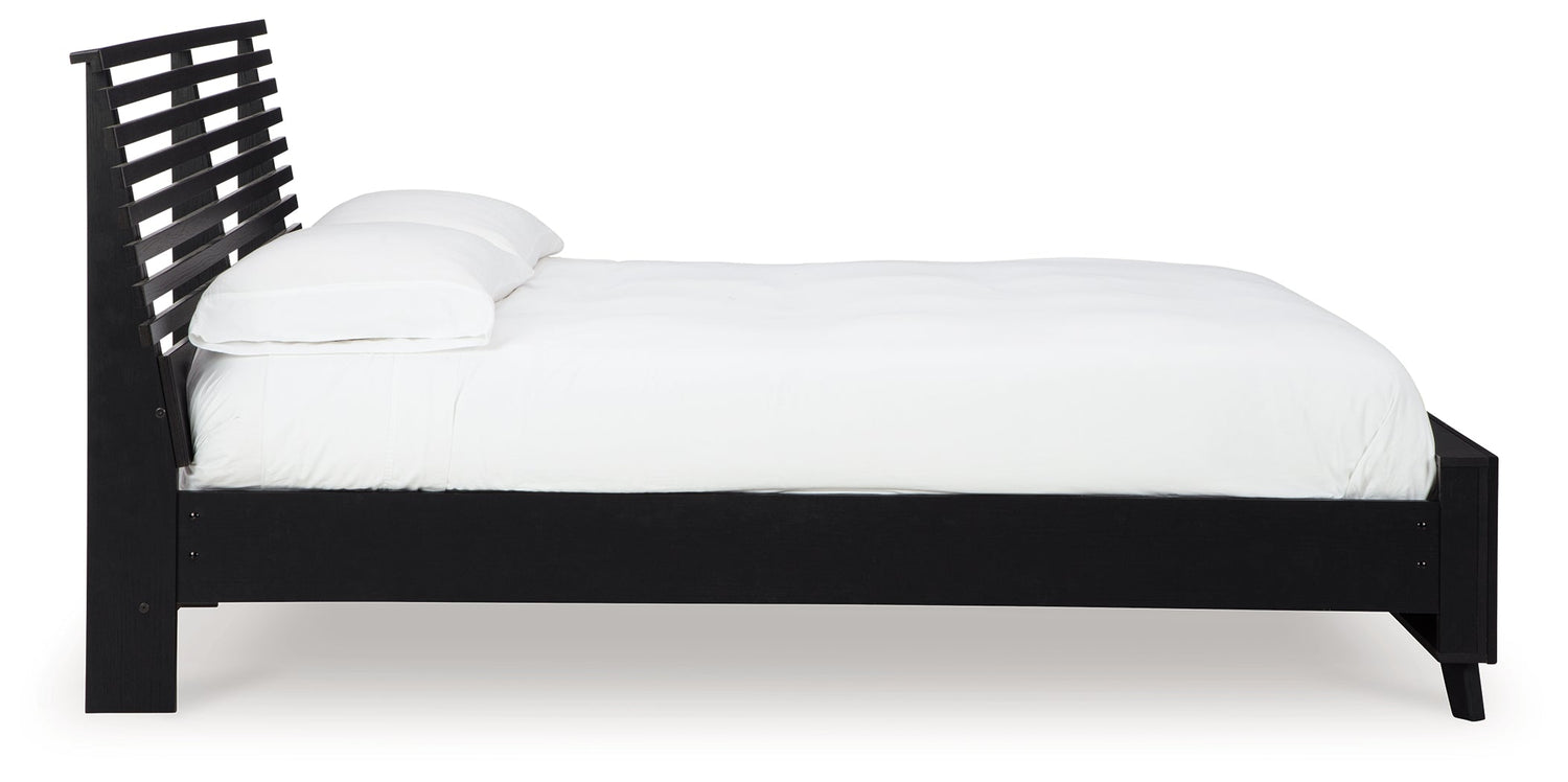 Danziar Queen Panel Bed with Mirrored Dresser and Nightstand in Black - PKG015898