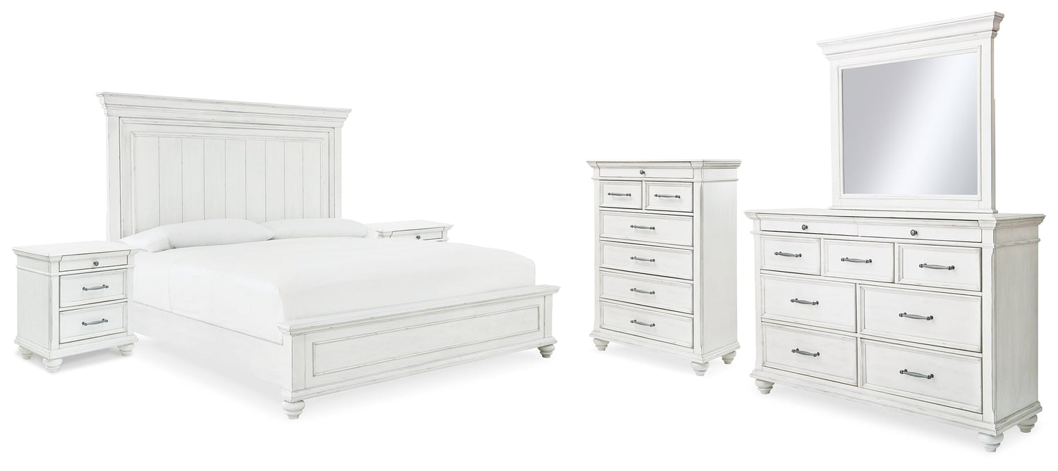 Kanwyn King Panel Bed with Mirrored Dresser, Chest and 2 Nightstands in Whitewash from Ashley - Luna Furniture