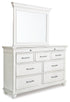 Kanwyn Whitewash Cal King Upholstered Panel Bed, Dresser, Mirror and Chest - B777B23