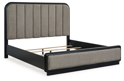 Rowanbeck King Upholstered Panel Bed with Mirrored Dresser, Chest and 2 Nightstands in Gray/Black from Ashley - Luna Furniture