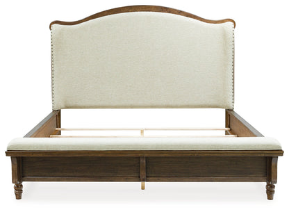 Sturlayne California King Upholstered Panel Bed with Dresser and 2 Nightstands in Brown from Ashley - Luna Furniture