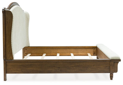 Sturlayne King Upholstered Panel Bed with Mirrored Dresser, Chest and 2 Nightstands in Brown from Ashley - Luna Furniture