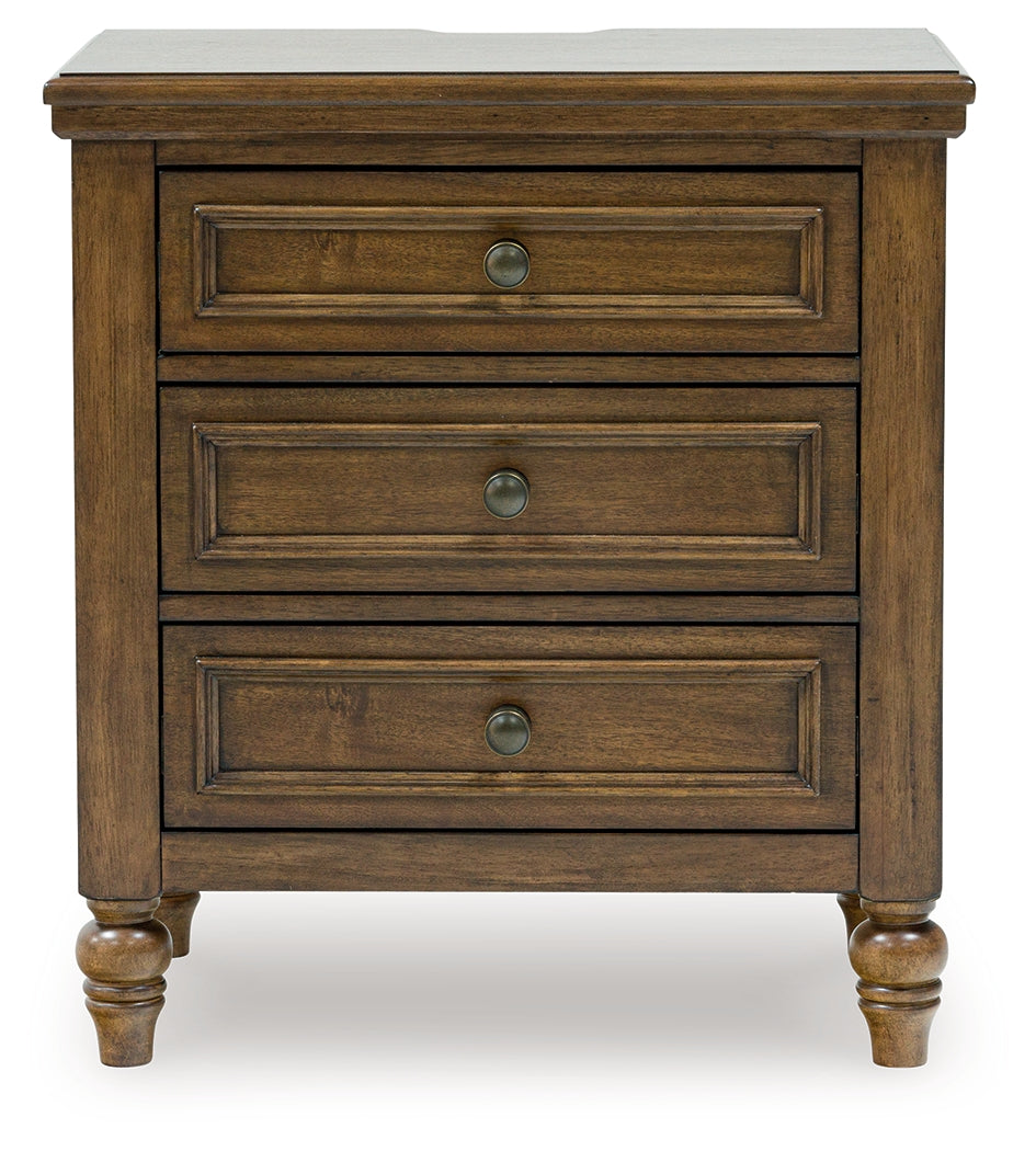 Sturlayne Queen Upholstered Panel Bed with Mirrored Dresser, Chest and 2 Nightstands in Brown from Ashley - Luna Furniture