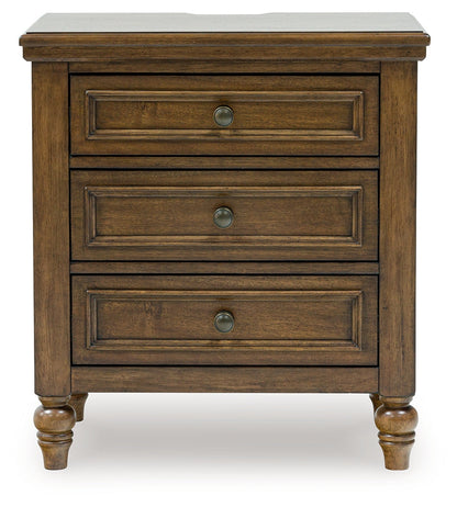 Sturlayne Queen Upholstered Panel Bed with Mirrored Dresser, Chest and Nightstand in Brown from Ashley - Luna Furniture