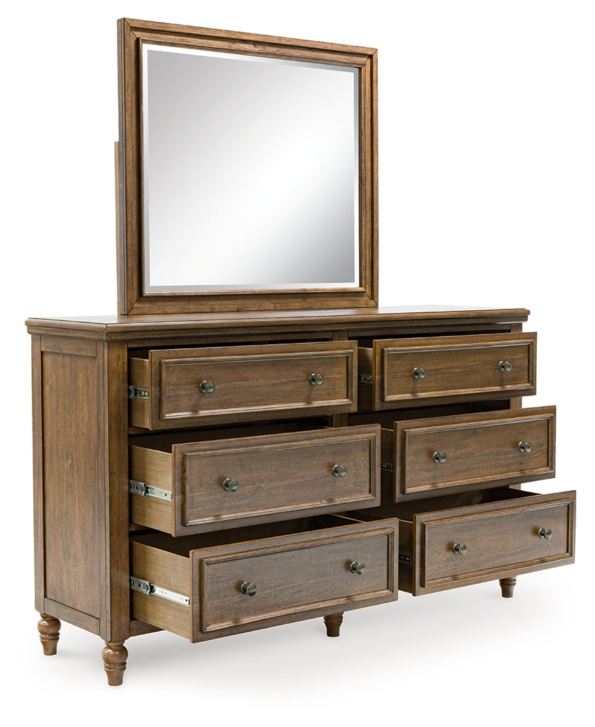 Sturlayne Queen Upholstered Panel Bed with Mirrored Dresser, Chest and Nightstand in Brown from Ashley - Luna Furniture
