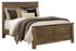 Trinell Brown Queen Panel Bed, Dresser, Mirror and Nightstand - B446B88