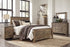 Trinell King Panel Bed with Dresser, Chest and 2 Nightstands in Brown from Ashley - Luna Furniture