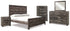 Wynnlow King Crossbuck Panel Bed with Mirrored Dresser, Chest and Nightstand in Gray - PKG005695